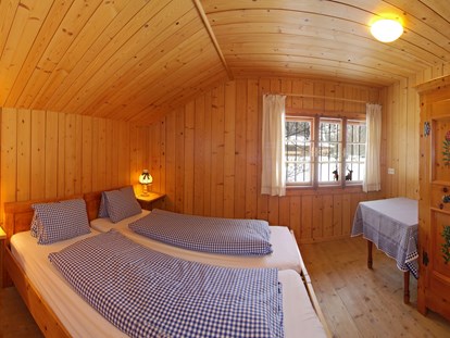 Luxuscamping - Art der Unterkunft: Bungalow - Österreich - Schlafzimmer Steinbach Stube - Grubhof Almhütte Steinbach Stube im Almdorf Grubhof