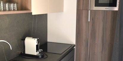 Luxuscamping - WC - Faaker-/Ossiachersee - Modernst ausgestattete Küche - Terrassen Camping Ossiacher See Premium Mobilheime mit Terrassen am Terrassen Camping Ossiacher See