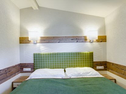 Luxuscamping - Umgebungsschwerpunkt: Therme - Chalet Schlafzimmer - Camping Brunner am See