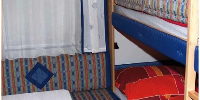 Luxuscamping - Seenplatte - Gerade für Kinder ein besonderes Erlebnis- das schlafen in Etagenbetten. - Naturcamping Malchow Wohnwagen auf Naturcamping Malchow