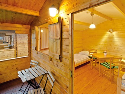 Luxury camping - Terrasse - Mecklenburg-Western Pomerania - Campingpl. NATURCAMP Pruchten Blockhütten
