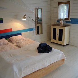 Glampingunterkunft: Das Cottage bietet Platz für 4 Erwachsene, mit einem Doppelbett und Ausziehsofa. - Cottage auf Camping Zürich
