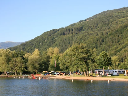 Luxury camping - Austria - Strand von Camping Brunner - Camping Brunner am See Chalets auf Camping Brunner am See
