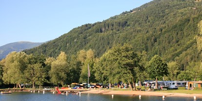 Luxuscamping - Terrasse - Strand von Camping Brunner - Camping Brunner am See Chalets auf Camping Brunner am See