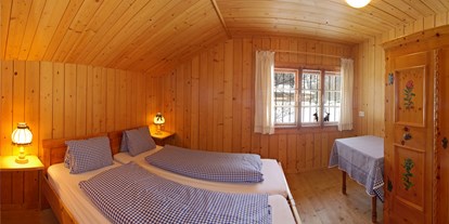 Luxuscamping - Art der Unterkunft: Bungalow - Pinzgau - Schlafzimmer Steinbach Stube - Grubhof Almhütte Steinbach Stube im Almdorf Grubhof