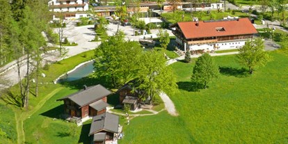 Luxuscamping - Art der Unterkunft: Bungalow - Pinzgau - Frühling im Almdorf am Grubhof - Grubhof Almhütte Steinbach Stube im Almdorf Grubhof