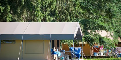 Luxuscamping - Ain - Camping Huttopia Divonne Zelt Toile & Bois Sweet für 5 Pers. auf Camping Huttopia Divonne