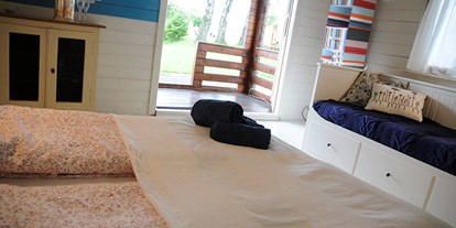 Luxuscamping - Art der Unterkunft: Bungalow - Zürich-Stadt - Das Cottage ist liebevoll eingerichtet, mit einer kleinen Veranda, aber ohne Bad und Küche. - Camping Zürich Cottage auf Camping Zürich