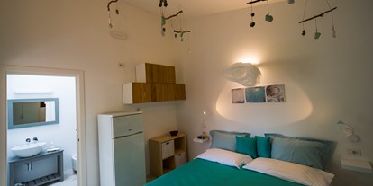 Luxuscamping - Klimaanlage - Italien - Superior-Einzimmer-Bungalow - Tiliguerta Glamping & Camping Village Superior-Einzimmer-Bungalows