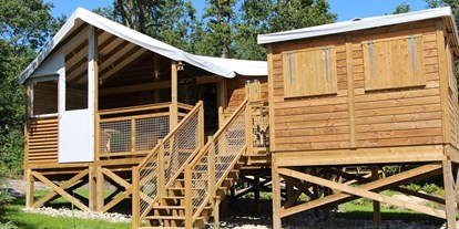 Luxuscamping - Gartenmöbel - Centre - Explorer Lodge von außen - Domaine des Alicourts Explorer Lodge für 6 Personen auf Domaine des Alicourts