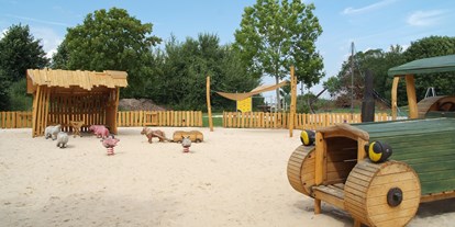 Luxuscamping - Terrasse - Ostfriesland - Unsere Kleinkind Spieloase - Freizeitpark "Am Emsdeich" Safari Zeltlodge mit exklusiver Ausstattung