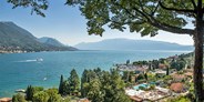 Luxuscamping - San Felice del Benaco - Mobilheim Moda 5/7 Pers 2 Zimmer AC mit Aussicht von Vacanceselect auf Camping Eden