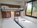 Glampingunterkunft: Mobilheim Moda 4/5 Personen 2 Zimmer Klimaanlage von Vacanceselect auf Camping Domaine du Colombier