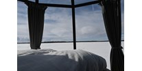 Luxuscamping - Nordschweden -  Am EinMorgen ein wunderschöner Ausblick auf den gefrorenen See. - Laponia Sky Hut Laponia Sky Hut