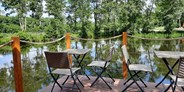 Luxuscamping - Whirlpool - Terrasse über dem Teich - Nord-Ostsee Camp Camping Pod