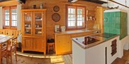 Luxuscamping - Art der Unterkunft: Bungalow - Österreich - gemütliche Stube mit vollausgestatteter Küche - Almhütte Scheffsnother Stube im Almdorf Grubhof