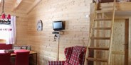 Luxuscamping - Preisniveau: gehoben - Landhaus - rundumblick - Blockhäuser auf Camping Langenwald