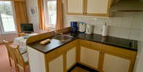 Luxuscamping - WC - Die Küche ist mit allen notwendigen Bestückt was einen Aufenthalt angenehm macht. - Ostseecamp Seeblick Bungalow Pelikan am Ostseecamp Seeblick