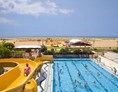 Glampingunterkunft: Pool mit Wasserrutsche auf Villaggio Turistico Internazionale - Maxi-Caravan Plus am Villaggio Turistico Internazionale