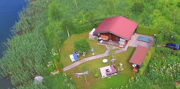 Luxuscamping - Preisniveau: exklusiv - Insel am See - See-Bungalow direkt am Terrassen Camping Ossiacher See