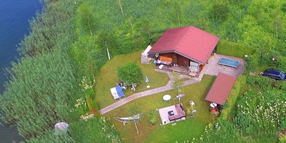 Luxuscamping - Hundewiese - Österreich - Insel am See - See-Bungalow direkt am Terrassen Camping Ossiacher See