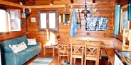 Luxuscamping - Preisniveau: exklusiv - Österreich - Gemütlichkeit am See - See-Bungalow direkt am Terrassen Camping Ossiacher See