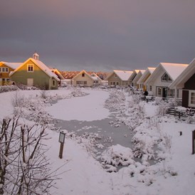 Glampingunterkunft: Ferienhäuser Sonnenuntergang im Winter - Ferienhaus Malmö am Südsee-Camp