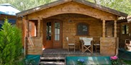 Luxuscamping - Art der Unterkunft: Campingfahrzeug - Holzhütte - Holzhütten auf Thalatta Camp
