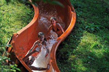Glampingunterkunft: Wasserrutsche am eigenen Badesee - Safari-Lodge-Zelt "Hippo" am Nature Resort Natterer See