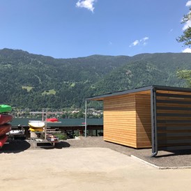 Glampingunterkunft: Wassersportstation - Ferienhaus Premium am Seecamping Berghof