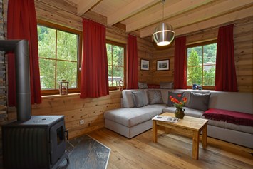 Glampingunterkunft: Wohnraum - Ferienhaus - Ferienhaus Premium am Seecamping Berghof