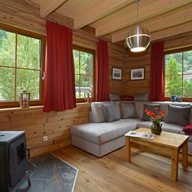 Glampingunterkunft: Wohnraum - Ferienhaus - Ferienhaus Premium am Seecamping Berghof